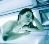 lady in tanning bed for UV tanning